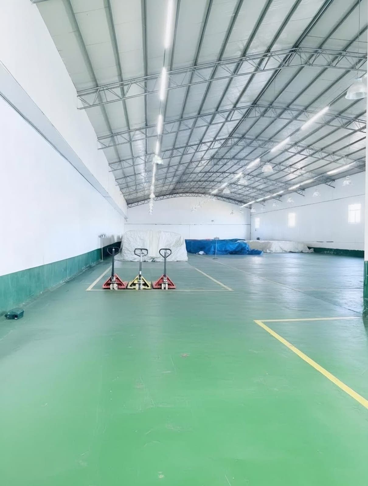 Clean finished-goods warehouse with palletized stocks ready for dispatch
